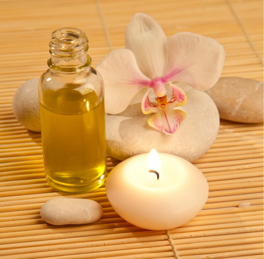 Spa essentials with candle and orchid